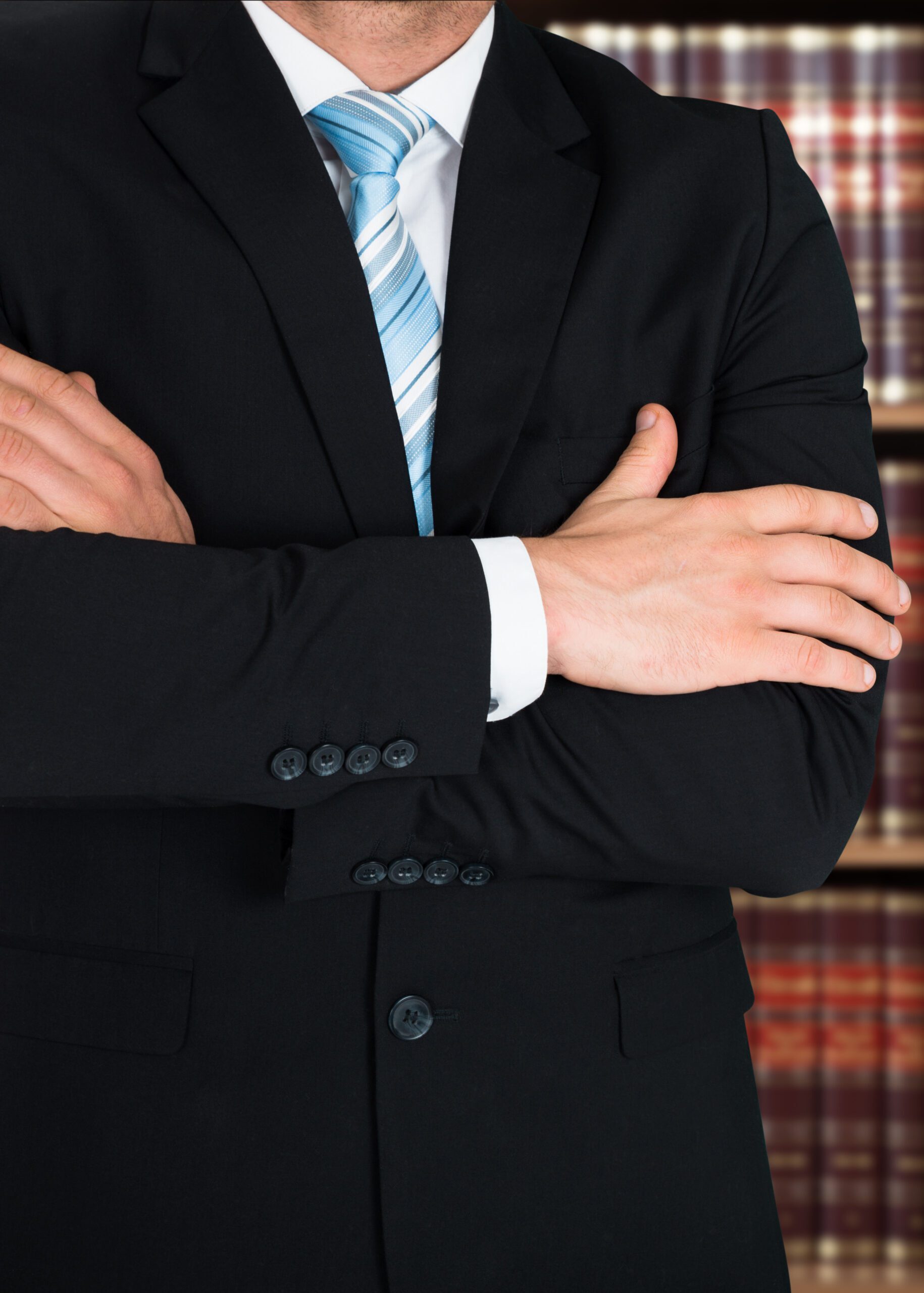 Midsection Of Lawyer With Arms Crossed Midsection Of Lawyer With Arms Crossed